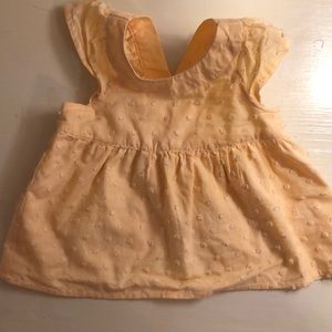 Yellow baby dress with open cris cross back